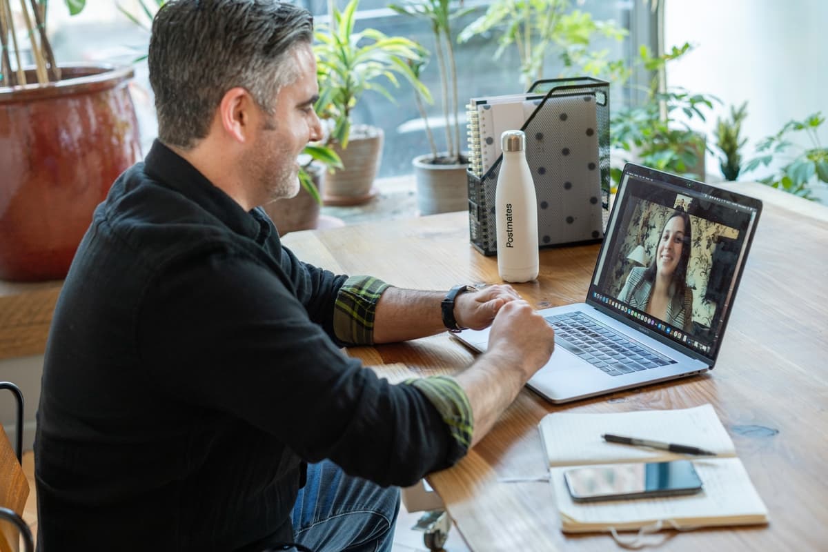 Man and woman using the best video interviewing software for their needs