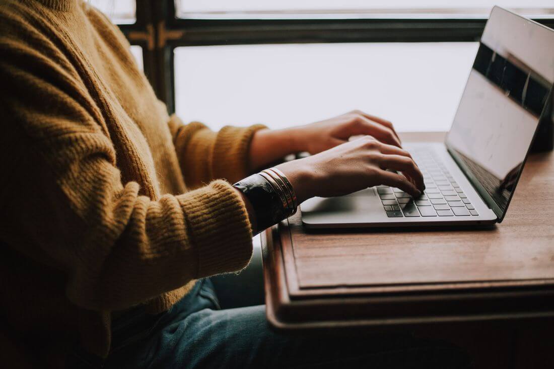 Woman at computer conducting a live remote interview